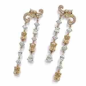 Luxury 18K white and rose gold tassel earrings featuring radiant-cut fancy brown diamonds and brilliant white diamonds totaling 5.45 carats.