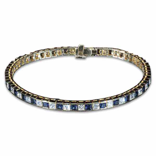 Luxury 18K yellow gold tennis bracelet featuring alternating natural princess-cut blue sapphires and brilliant-cut diamonds totaling 8.85 carats.