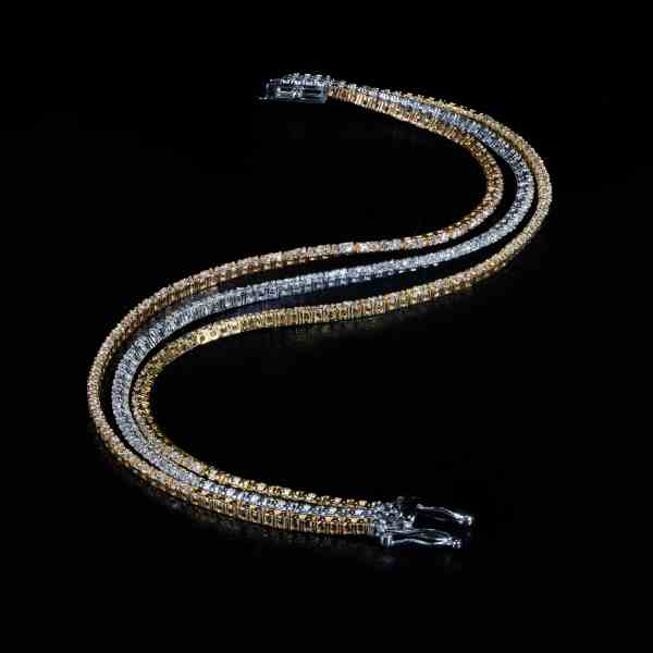 Luxury 18K tri-color gold tennis necklace featuring 216 natural round brilliant-cut diamonds totaling 2.50 carats.