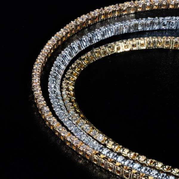 Luxury 18K tri-color gold tennis necklace.