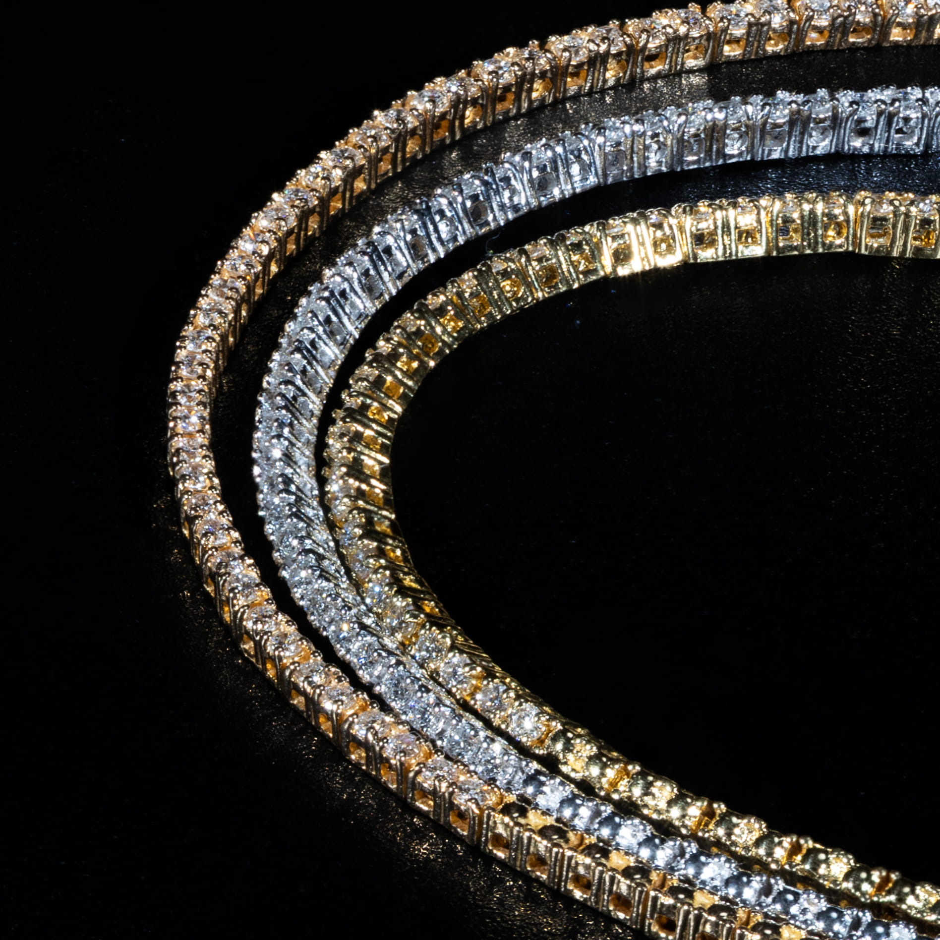 Luxury 18K tri-color gold tennis necklace.
