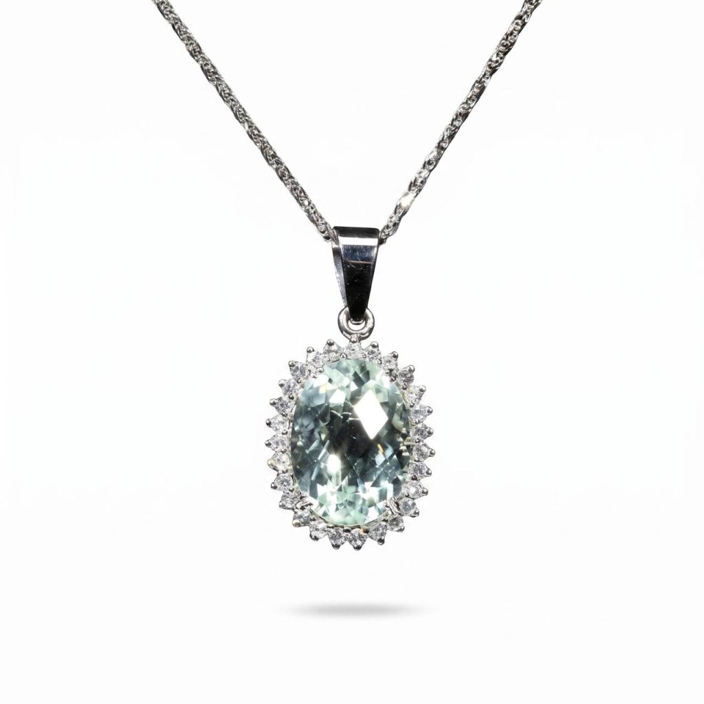 Elegant 18K white gold pendant necklace featuring a natural oval-cut aquamarine surrounded by a halo of brilliant natural diamonds suspended from a matching white gold chain.