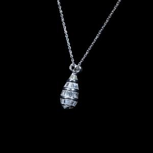 white gold pendant necklace featuring natural baguette-cut and round brilliant diamonds suspended from a matching white gold chain.