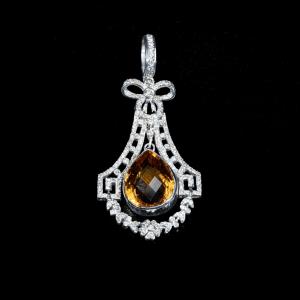 Elegant 18K white gold pendant necklace featuring a pear-shaped natural citrine surrounded by brilliant-cut natural diamonds in an intricate vintage-inspired setting.
