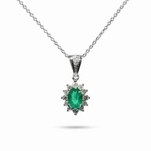 Elegant 18K white gold pendant necklace featuring a natural Colombian emerald surrounded by a halo of brilliant natural diamonds suspended from a matching white gold chain.