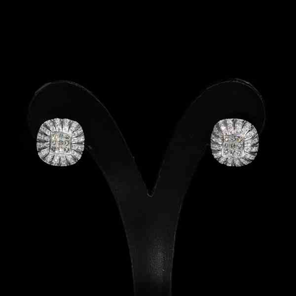 Luxury 18K white gold jewelry set featuring a matching diamond pendant with chain and stud earrings set with princess-cut and brilliant-cut natural diamonds.