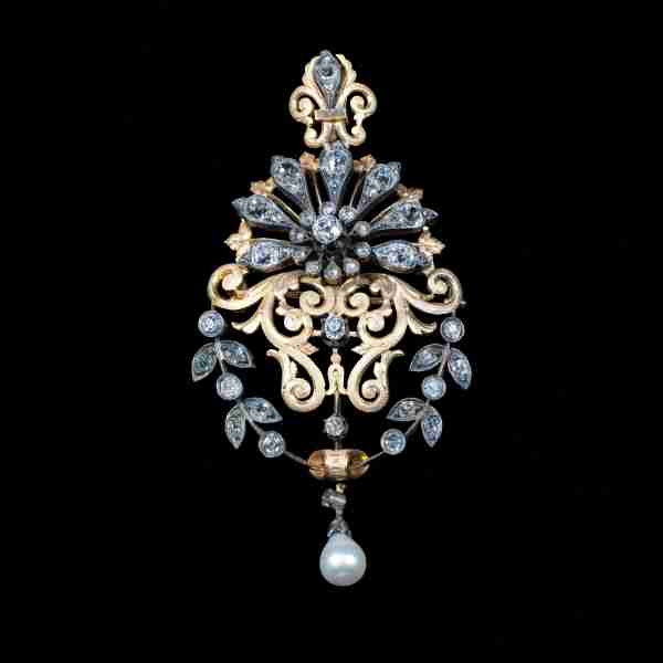 Antique gold and silver pendant brooch with Old Cut diamonds with a natural pearl drop in an ornate handcrafted design.