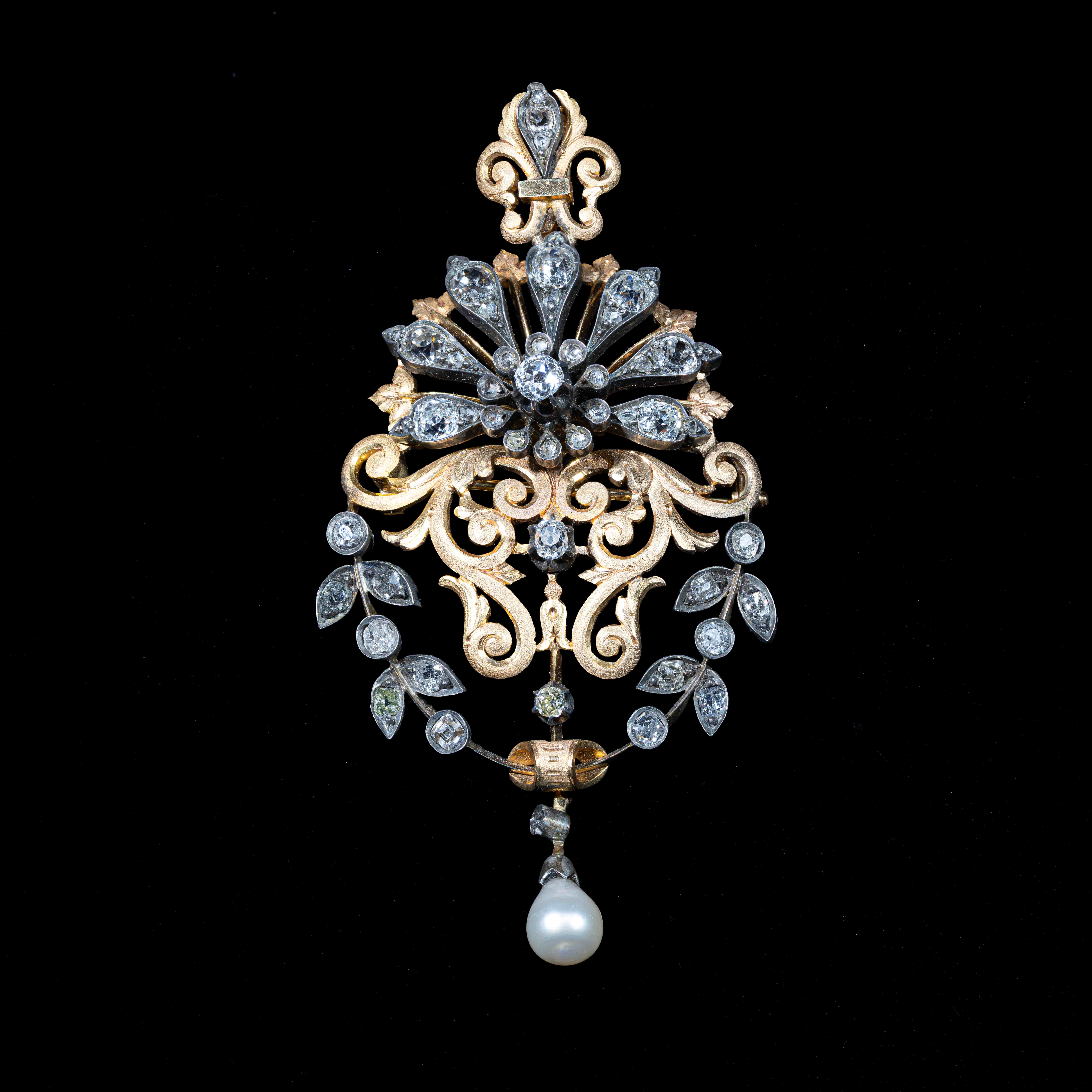 Antique gold and silver pendant brooch with Old Cut diamonds with a natural pearl drop in an ornate handcrafted design.
