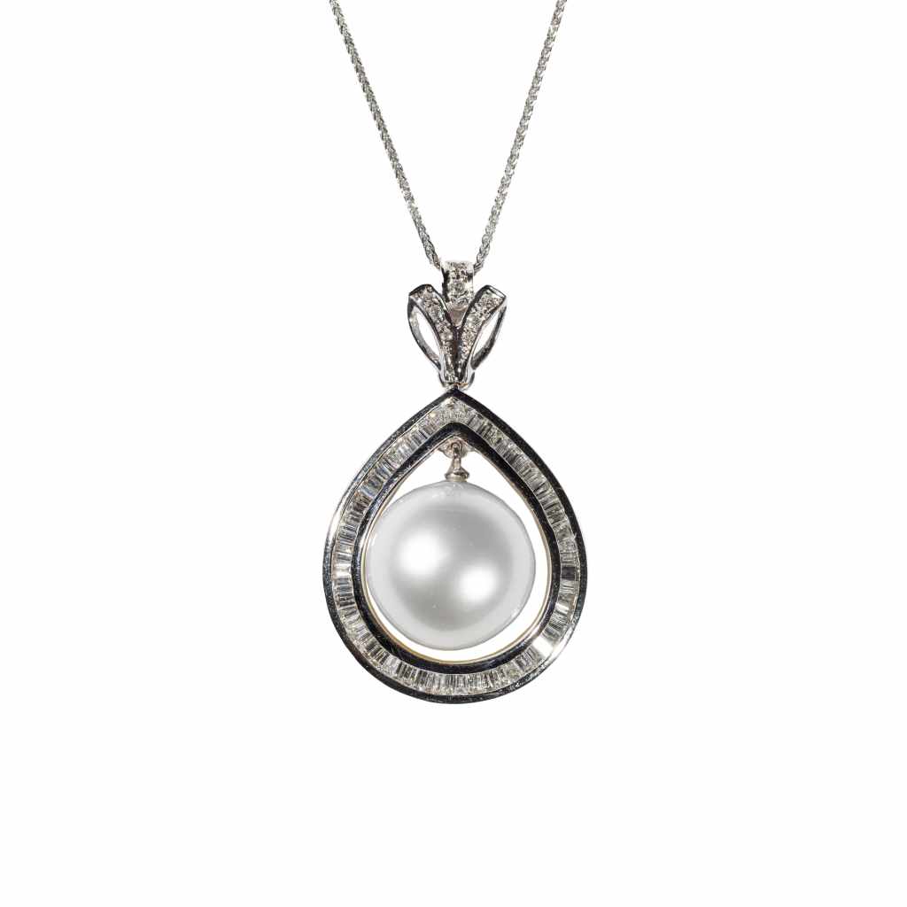 Aurora pearl diamond pendant necklace featuring a white pearl surrounded by baguette diamonds