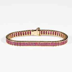 18K yellow gold tennis bracelet featuring natural step-cut Burmese rubies with GIA certification confirming Myanmar origin.