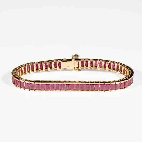 18K yellow gold tennis bracelet featuring natural step-cut Burmese rubies with GIA certification confirming Myanmar origin.