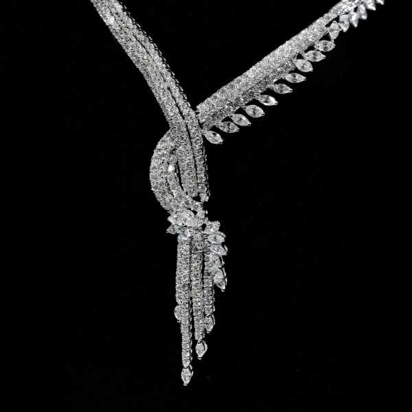 Luxury diamond statement necklace with cascading floral design in white gold finish detail
