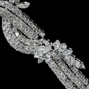 Luxury diamond statement necklace with cascading floral design in white gold finish closeup