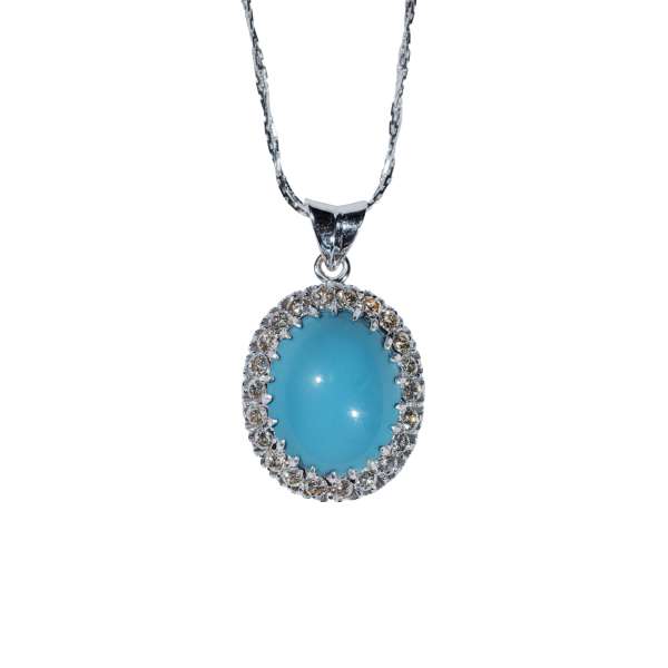 Celeste turquoise halo pendant necklace featuring an oval blue turquoise gemstone with sparkling halo setting
