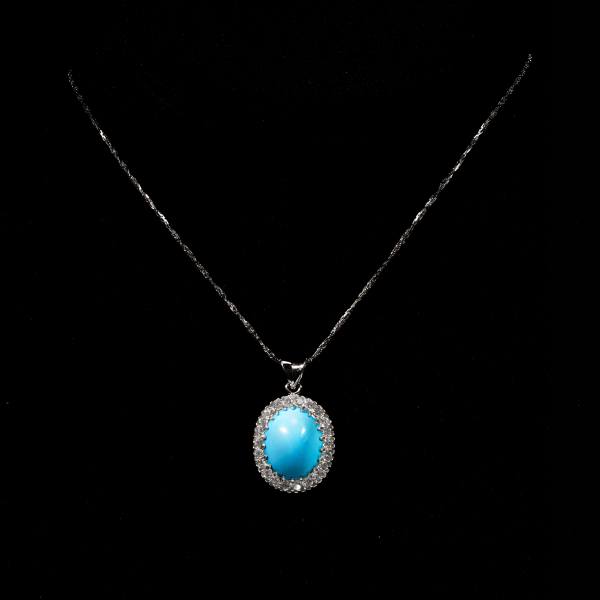 Celeste turquoise halo pendant woman necklace featuring an oval blue turquoise gemstone with sparkling halo
