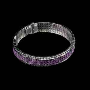 Luxury 18K white gold tennis bracelet featuring three rows of princess-cut natural pink sapphires, accented by natural diamonds.