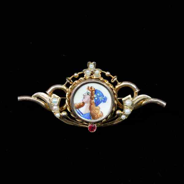 Victorian antique gold brooch featuring an original hand-painted porcelain miniature, natural seed pearls, and a ruby accent.