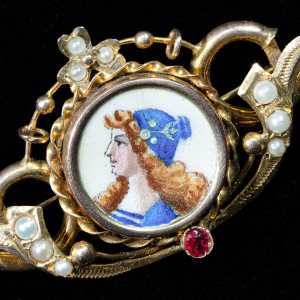 antique victorian gold brooch featuring an original hand-painted porcelain miniature, natural seed pearls, and a ruby accent.