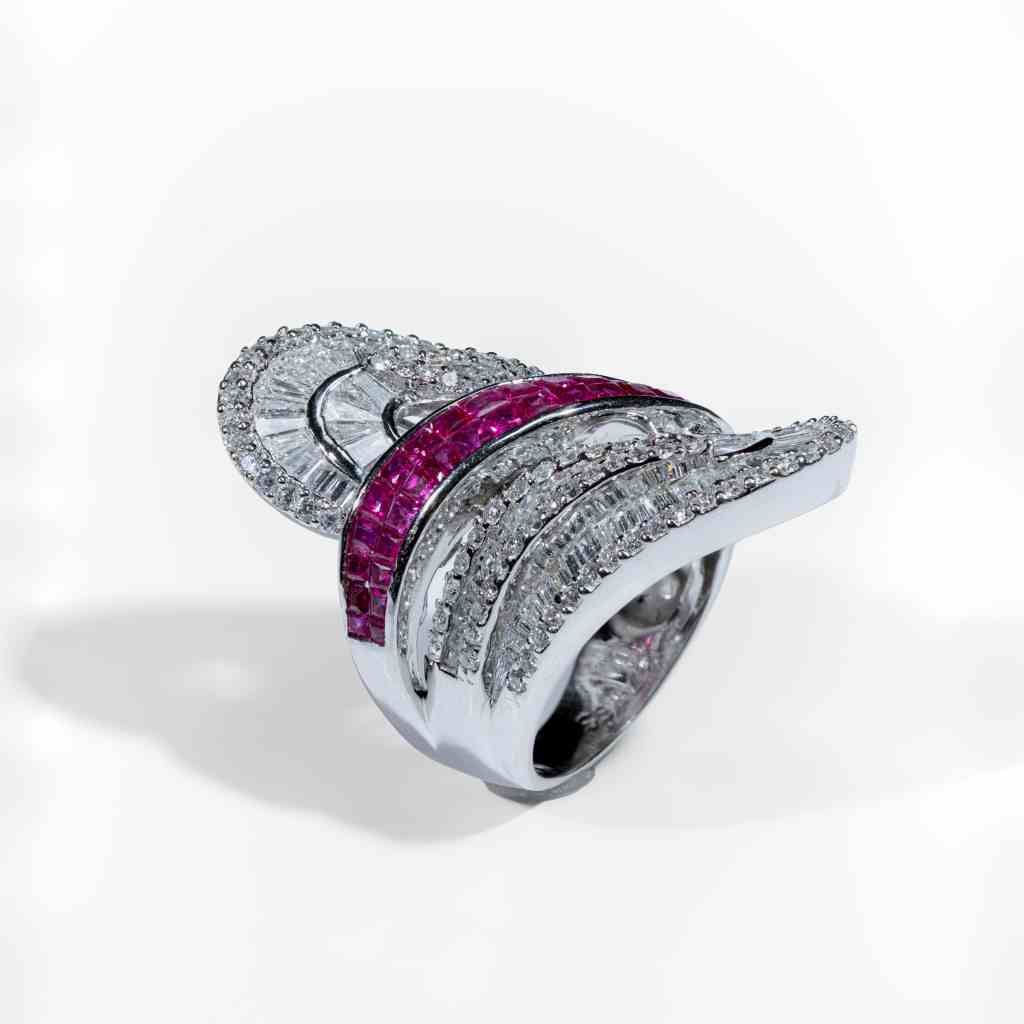 Luxury 18K white gold statement ring featuring natural rubies and 3.19 carats of brilliant diamonds in a contemporary sculptural design.