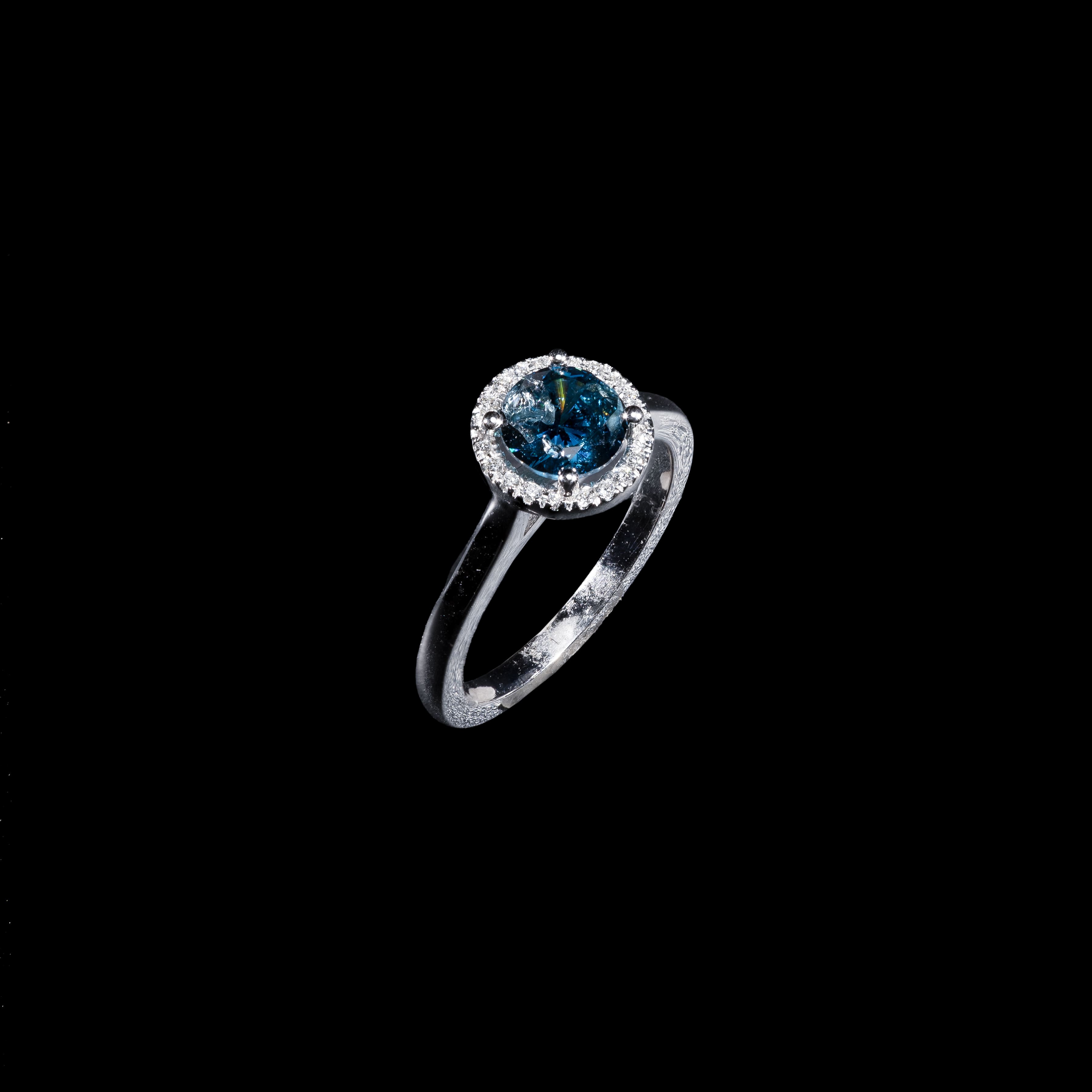 14K white gold halo ring with round blue diamond and white diamond accents