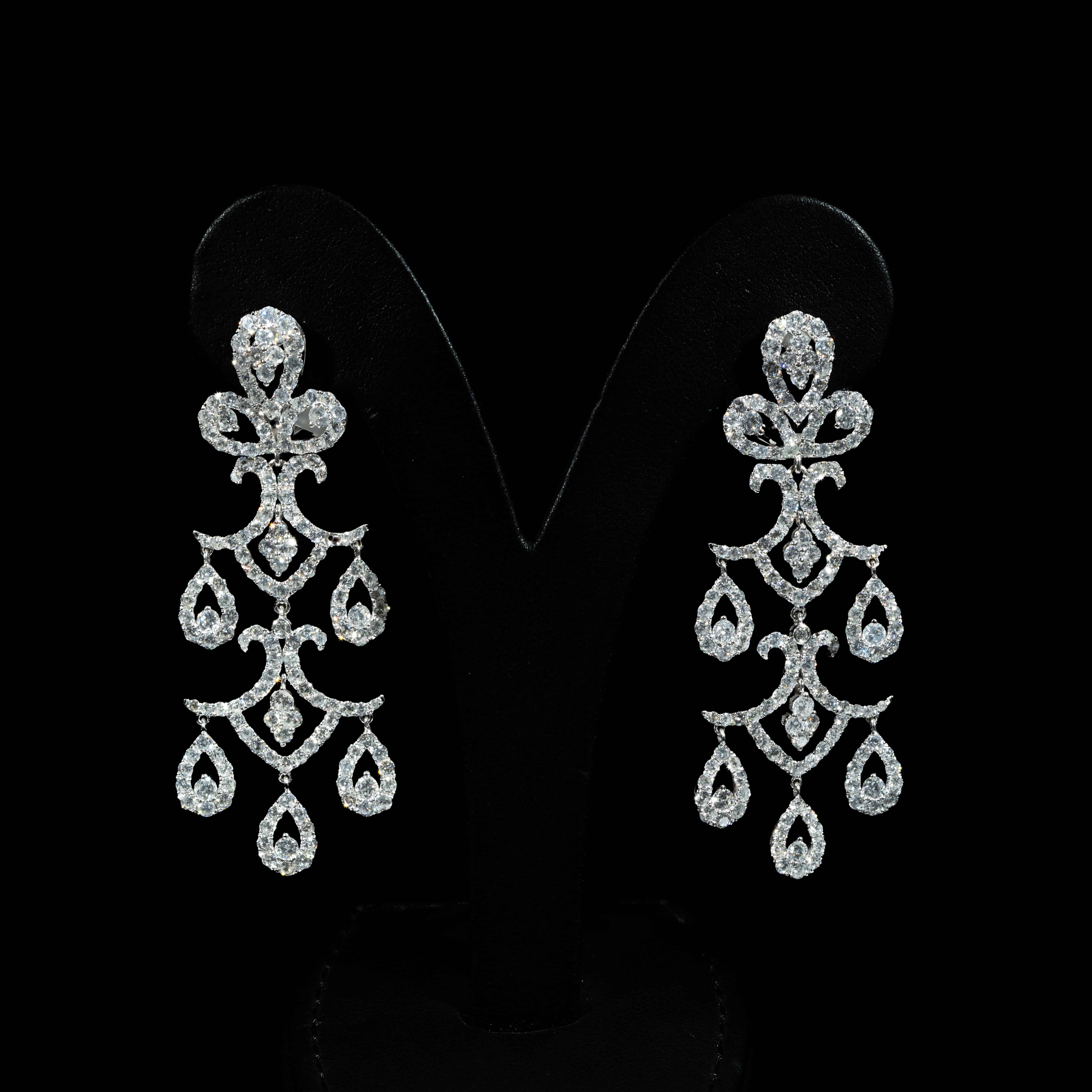18K white gold chandelier earrings featuring 9.09 carats of round diamonds in an elaborate cascading multi-drop design.