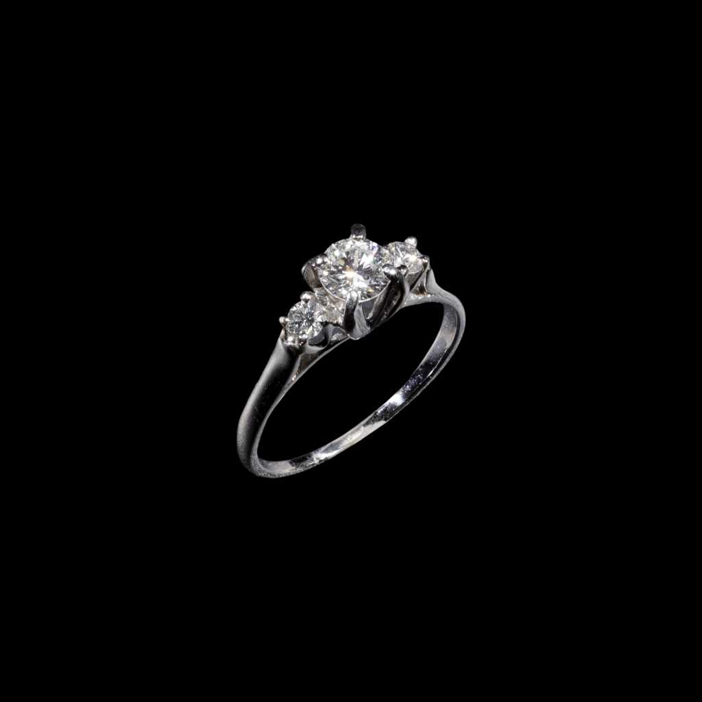 18K white gold three-stone ring with round diamonds