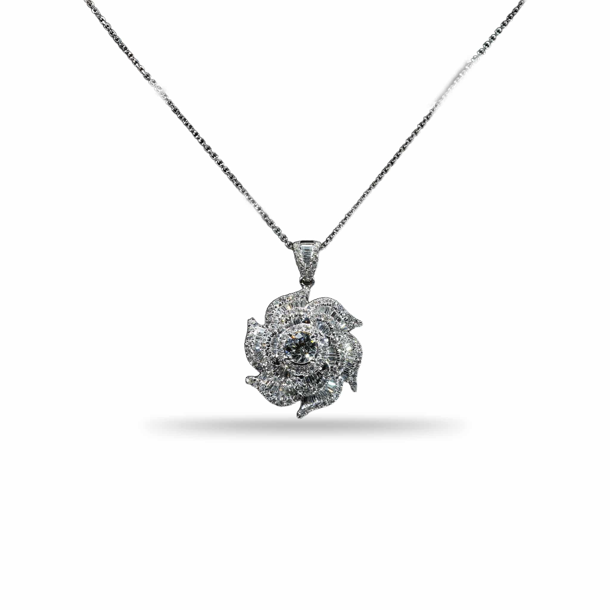 18K white gold floral pendant necklace featuring a 0.60 carat center diamond surrounded by baguette and round brilliant diamonds totaling 2.70 carats.