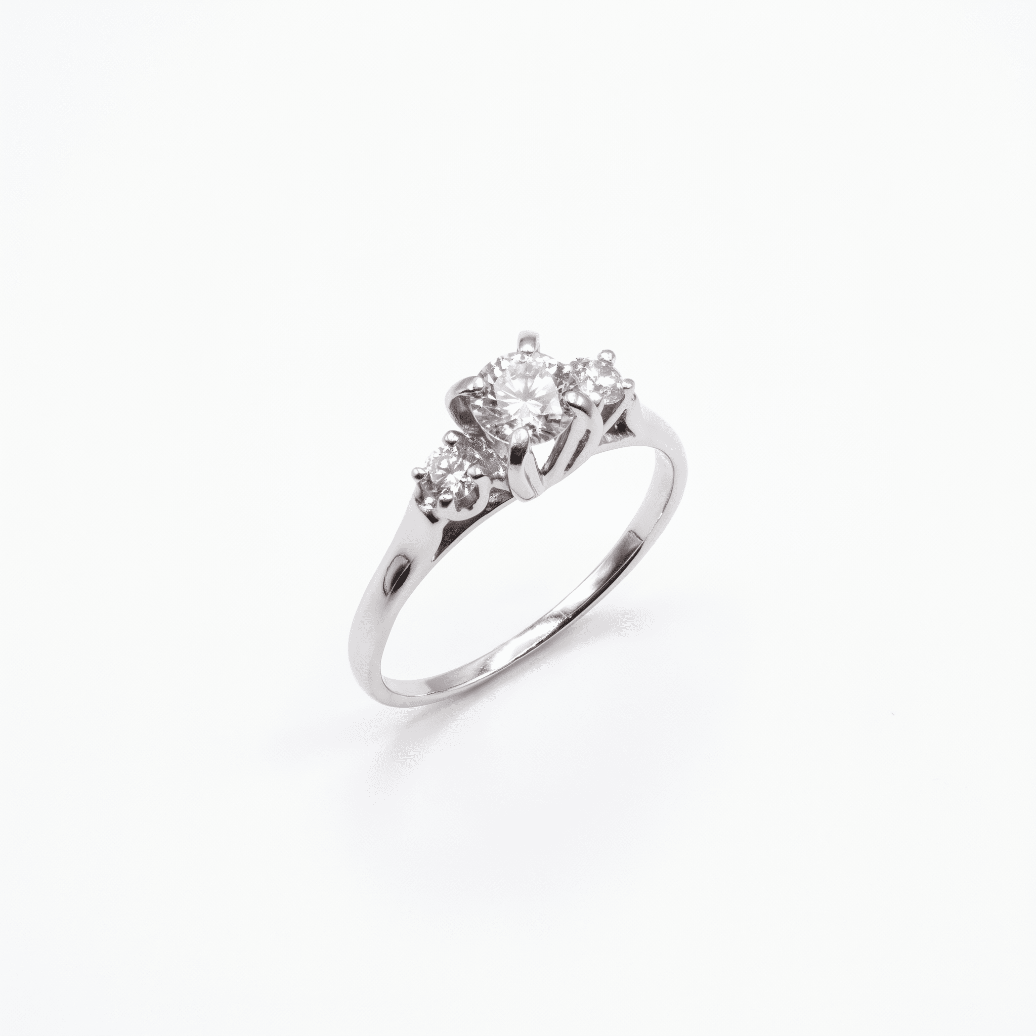 18K white gold three-stone ring with round diamonds