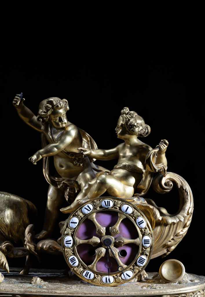19th-century French bronze and porcelain figural clock with children, goats and carriage scene