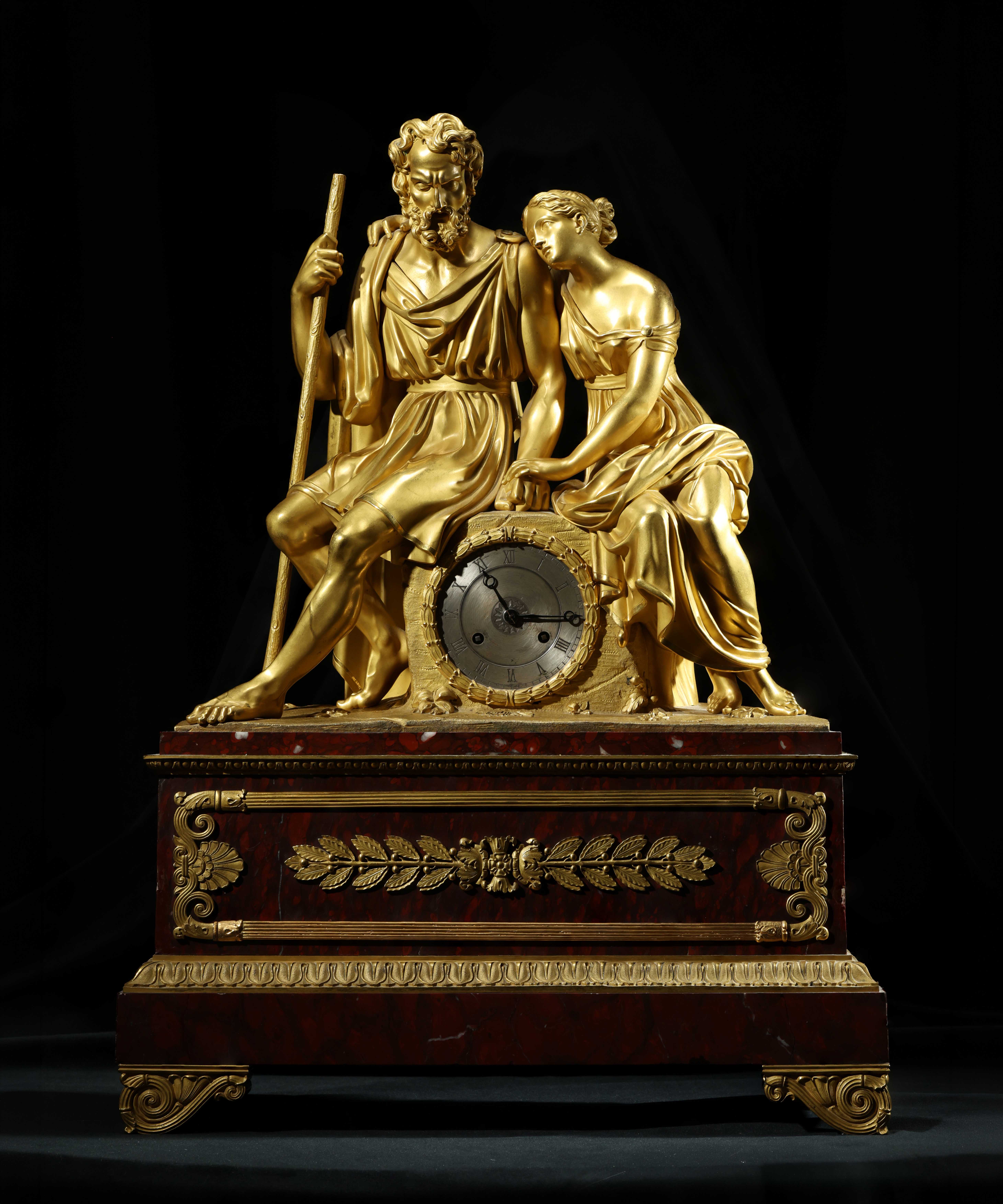 19th-century French gilt-bronze figural mantel clock with classical figures and ornate red base