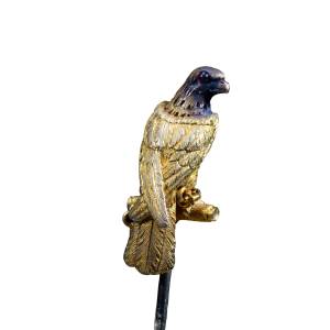 19th-century antique gold falcon brooch with detailed feathers and jeweled eye