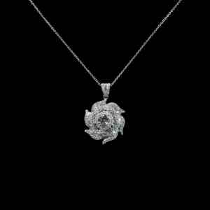 18K white gold floral pendant necklace featuring a 0.60 carat center diamond surrounded by baguette and round brilliant diamonds totaling 2.70 carats.