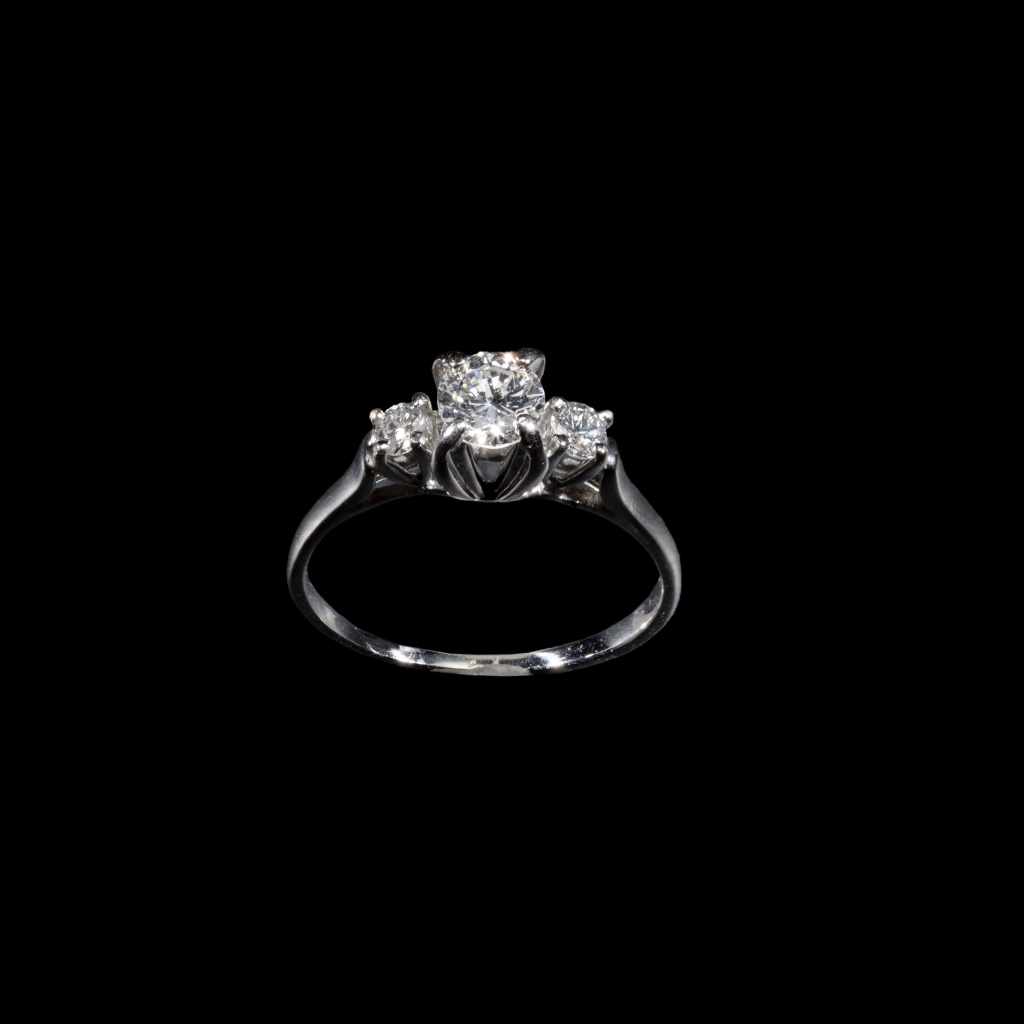 18K white gold three-stone ring with round diamonds