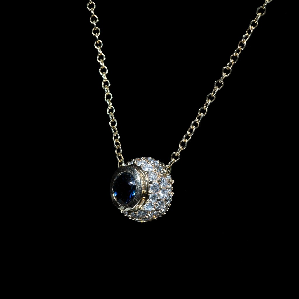 14K yellow gold blue sapphire and diamond halo necklace with round pendant