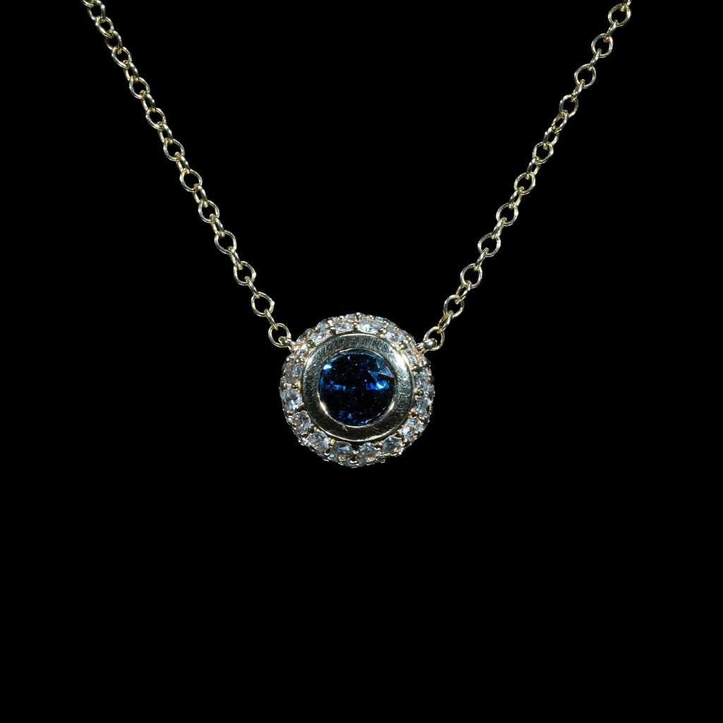 14K yellow gold blue sapphire and diamond halo necklace with round pendant