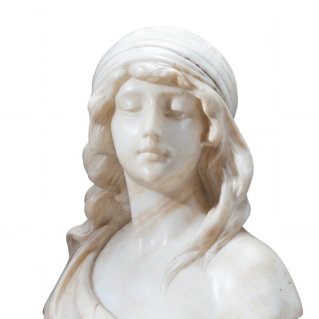 Circa 1900 European carved stone female bust on dark stone base