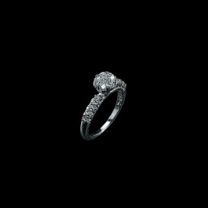 18K white gold diamond floral cluster ring with round brilliant diamonds and diamond-set shoulders.