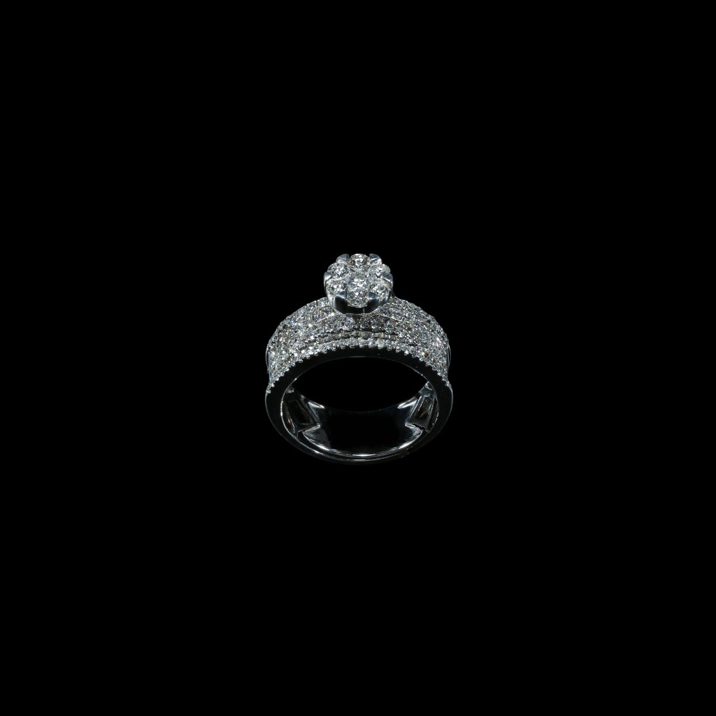 18K white gold statement ring with pavé-set diamonds and raised seven-diamond floral cluster.